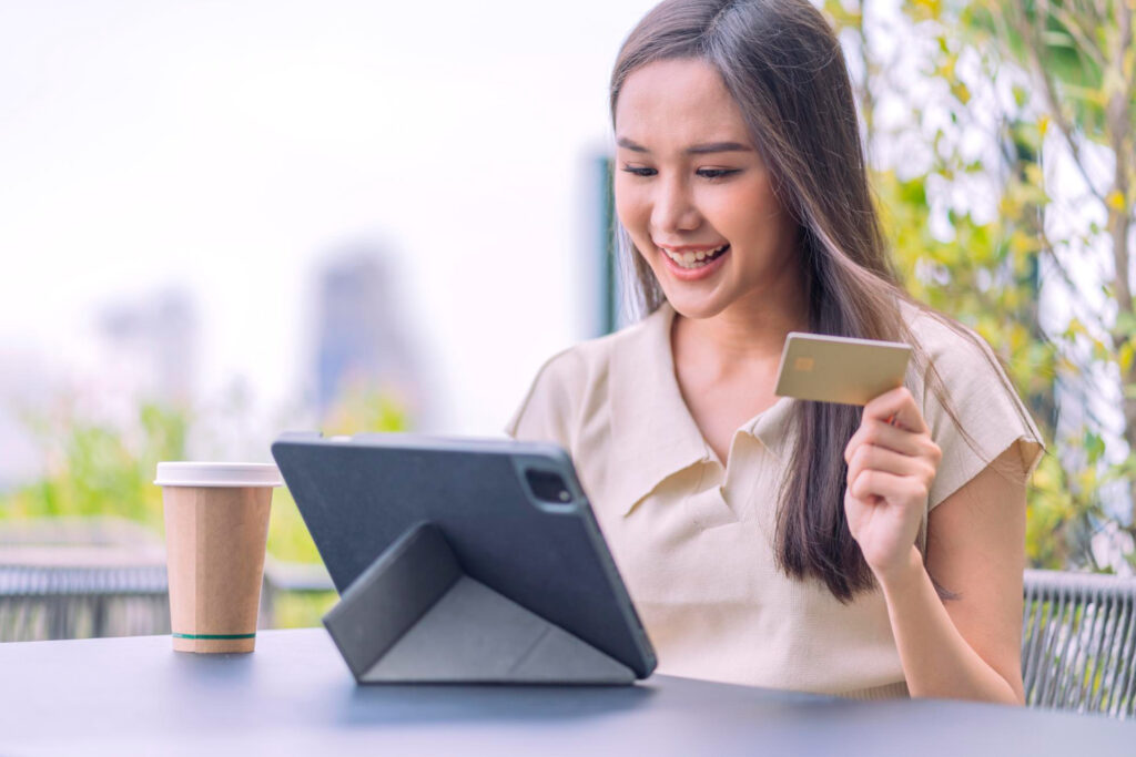 asian woman is buying online paying with credit cardfemale sitting cafe outdoor enjoying weekend vacation shopping online smartphone making mobile payment with credit card 1024x683 - Big Data Enhances Malaysian Internet Banking Customer Experience